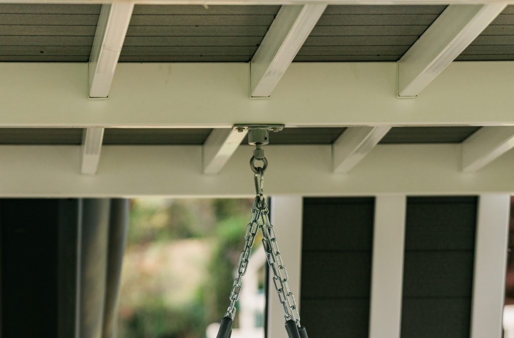 metal joist hangers on a vinyl swing set
