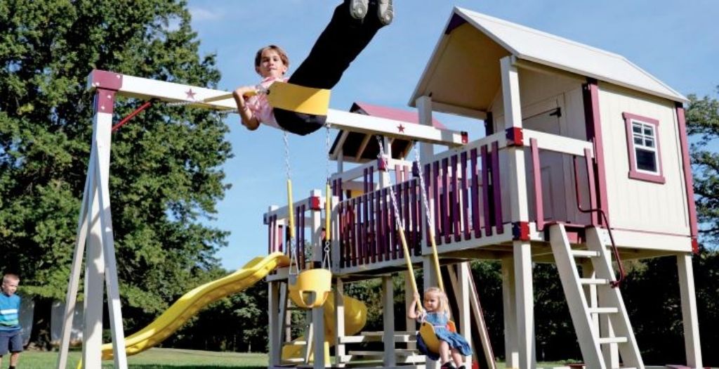 Boy swinging on vinyl swing set
