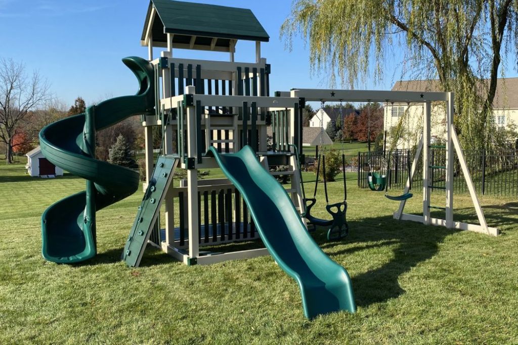 Vinyl climbing swingset with rock wall and slides 