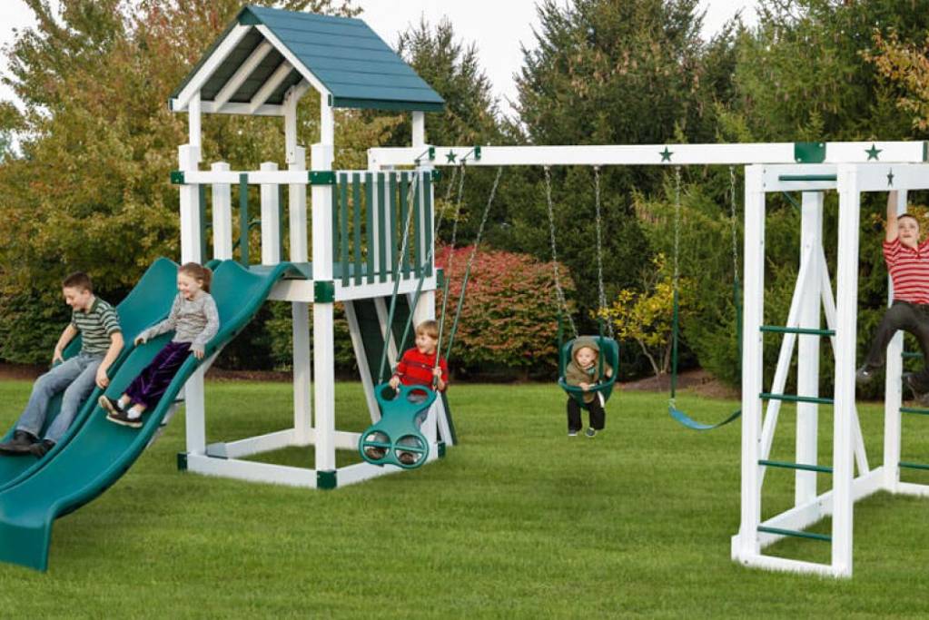 children playing on green playground sets for sale