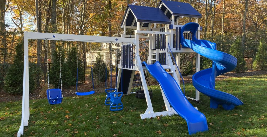 backyard playground with two slides and blue vinyl color
