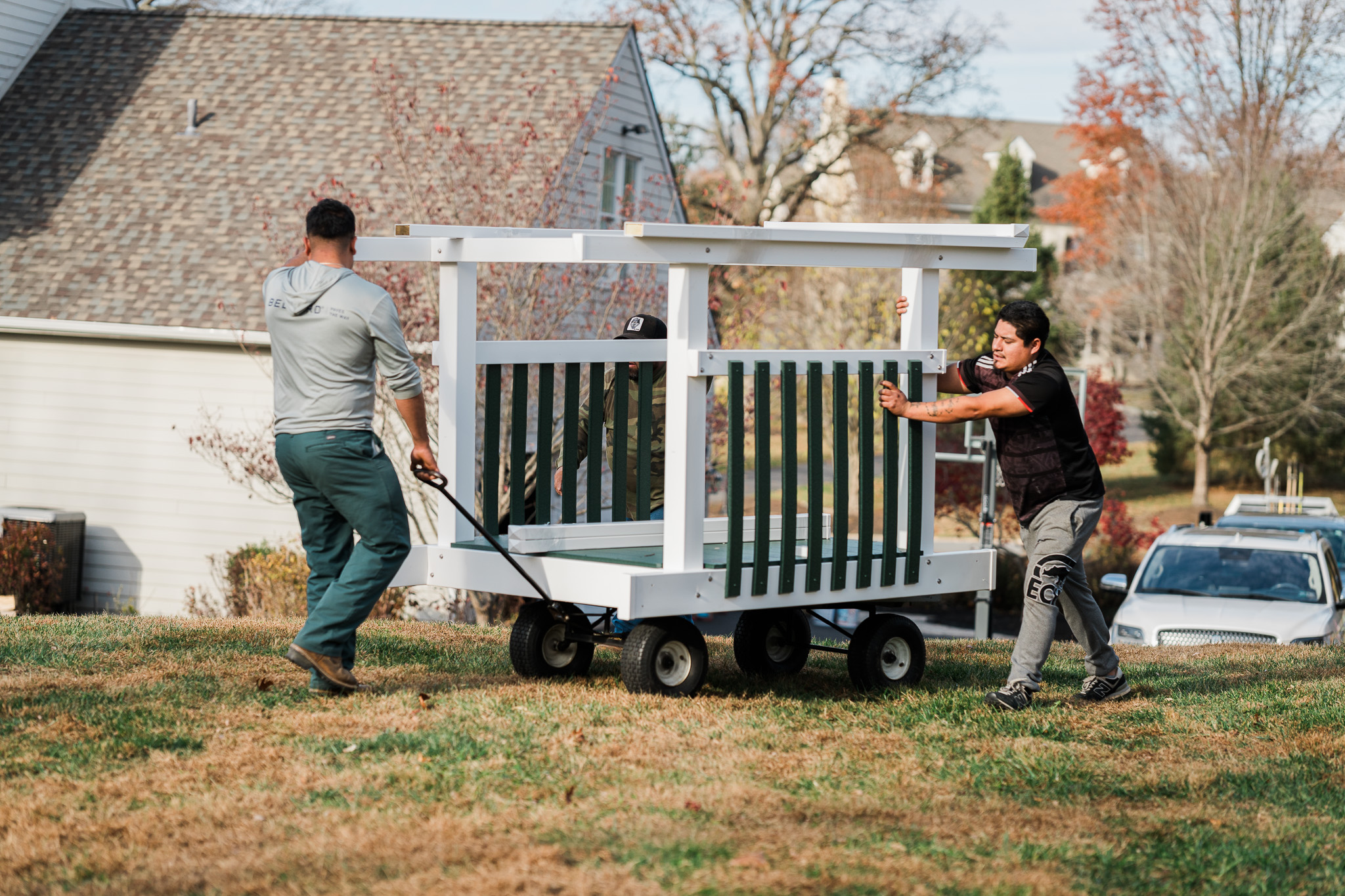 2 men installing a star quality swingsets swingset