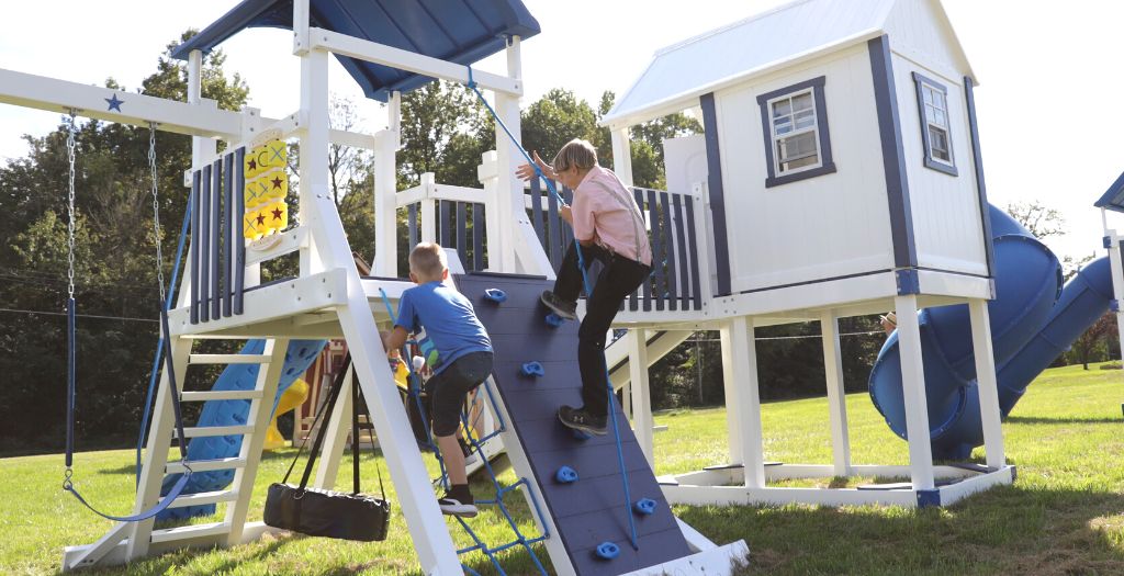swingset designs with rock climbing wall