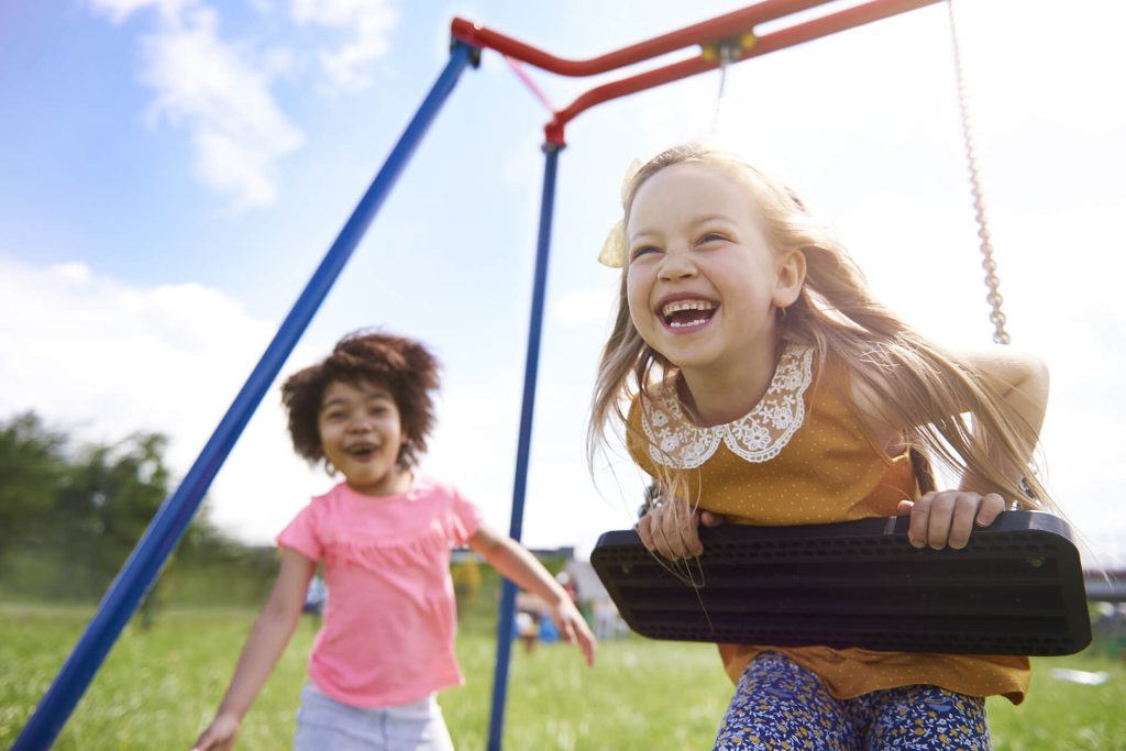 Kids playing in the swing