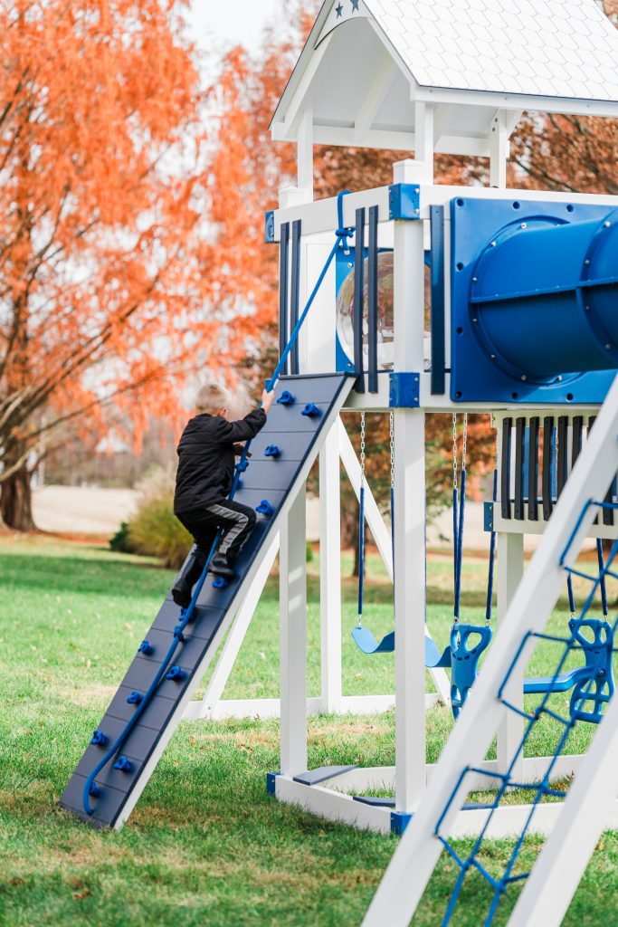 Swing set rock wall for older kids"